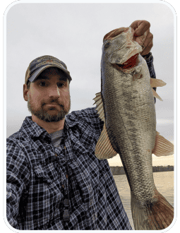 Image of the author holding a larger mouth bass.