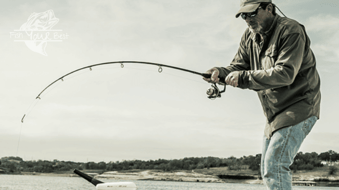Angler fishing from boat fighting a fish with one of his budget crappie rods.